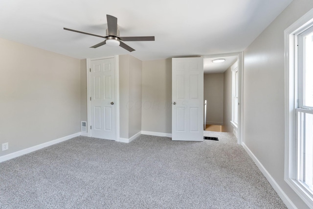 3189 E 6th Ave, Columbus, OH 43219 - unfurnished bedroom featuring carpet and ceiling fan