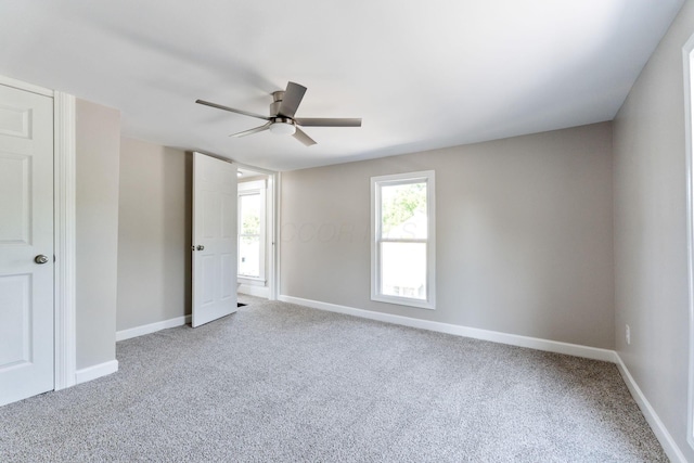 3189 E 6th Ave, Columbus, OH 43219 - unfurnished bedroom featuring carpet and a ceiling fan