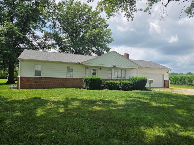 7376 Mink St SW, Pataskala, OH 43062 - view of front facade featuring a garage, a front lawn, and a chimney