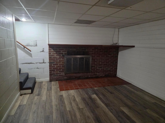 7376 Mink St SW, Pataskala, OH 43062 - unfurnished living room featuring wood finished floors, a fireplace, and a paneled ceiling