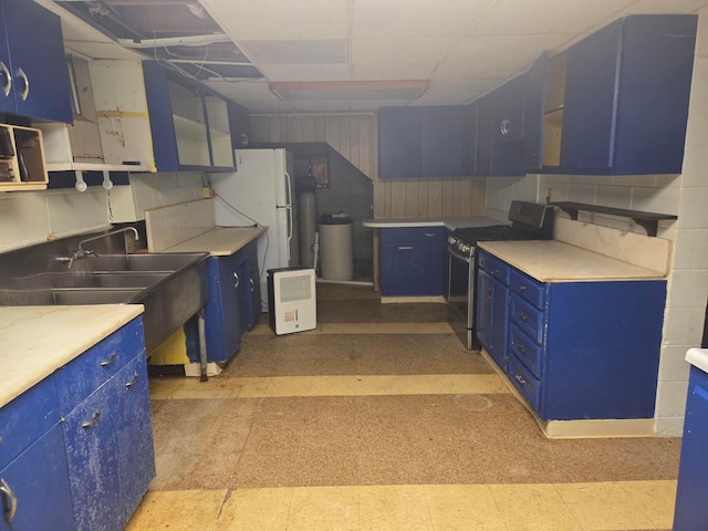 7376 Mink St SW, Pataskala, OH 43062 - kitchen featuring blue cabinetry, stainless steel electric range, light flooring, and light countertops