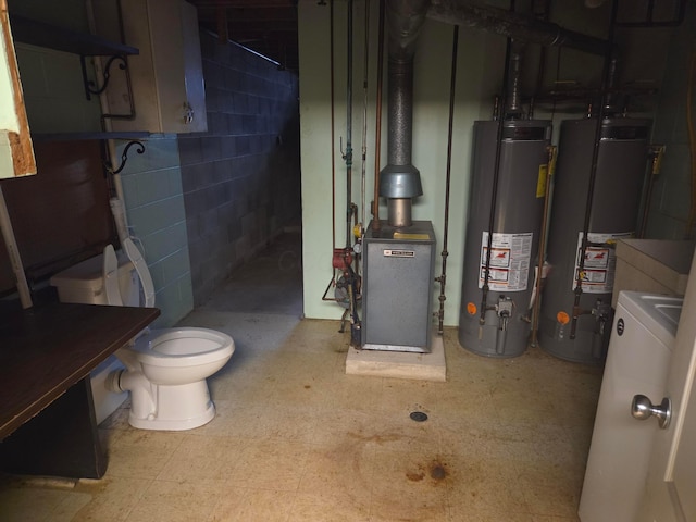 7376 Mink St SW, Pataskala, OH 43062 - below grade area with water heater, washer / clothes dryer, and a heating unit