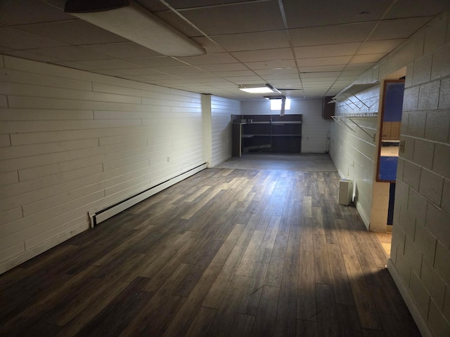 7376 Mink St SW, Pataskala, OH 43062 - below grade area featuring a baseboard radiator, dark wood-type flooring, a drop ceiling, and concrete block wall