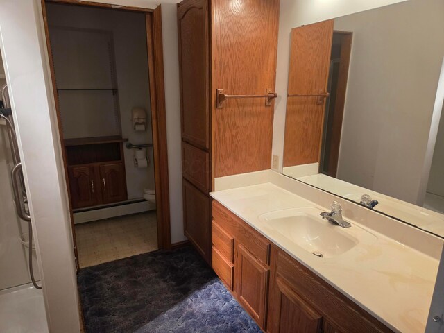 7376 Mink St SW, Pataskala, OH 43062 - bathroom with baseboard heating and vanity