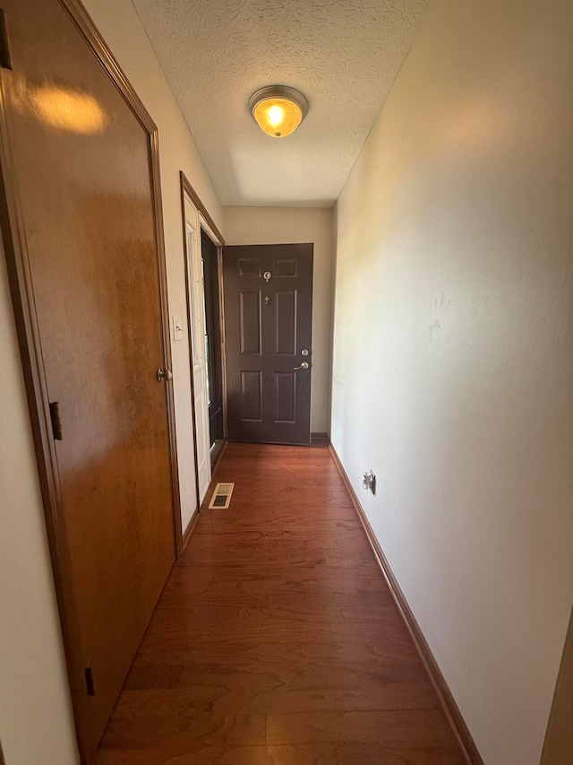 2022 Queensgate Ln, Columbus, OH 43235 - hall featuring dark wood-style flooring and a textured ceiling