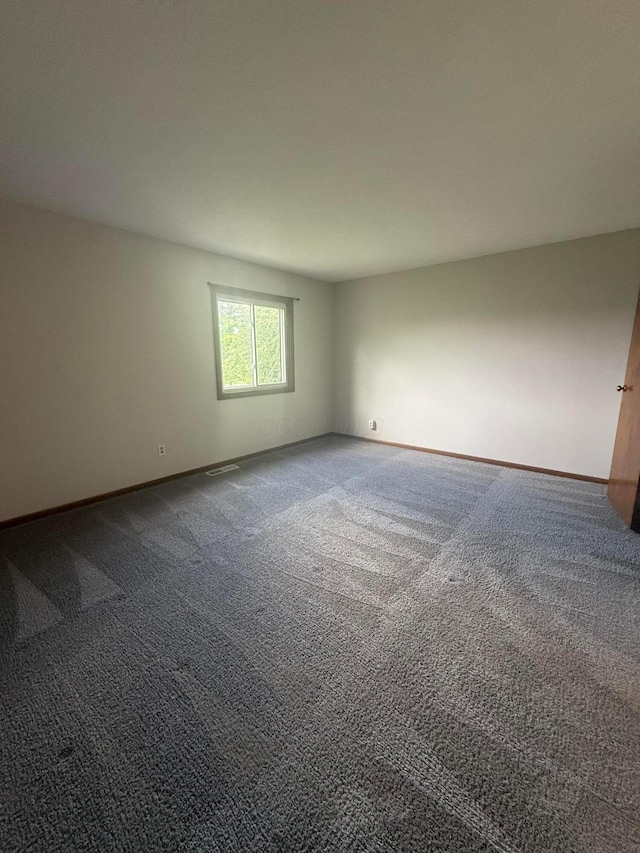 2022 Queensgate Ln, Columbus, OH 43235 - unfurnished room with dark colored carpet and baseboards
