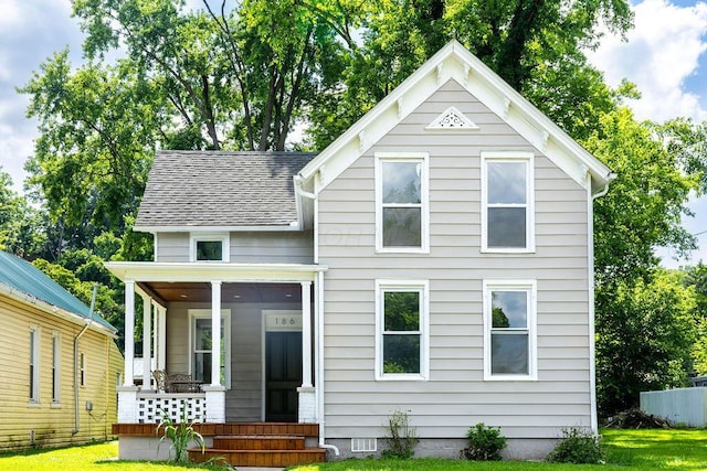 186 S Walnut St, Chillicothe, OH 45601 - victorian-style house with covered porch, a front lawn, and a shingled roof