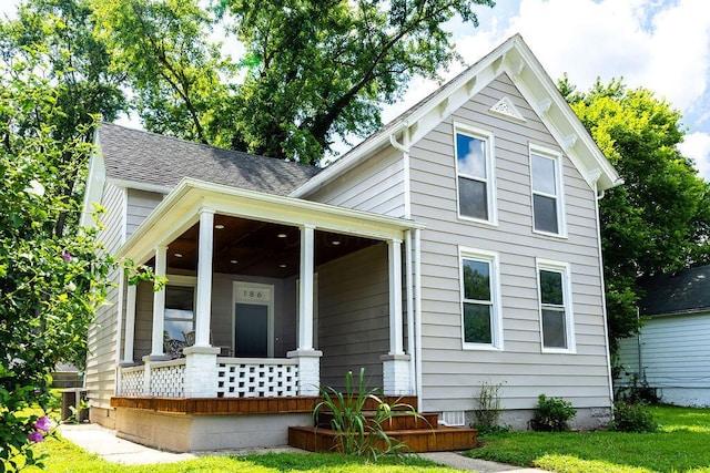 186 S Walnut St, Chillicothe, OH 45601 - view of front of house featuring covered porch, a front yard, and roof with shingles