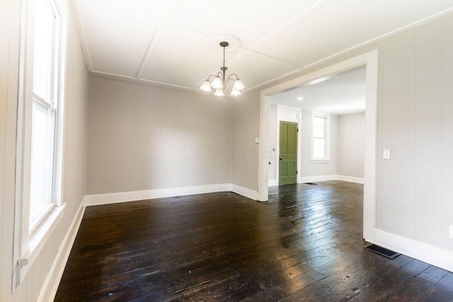 186 S Walnut St, Chillicothe, OH 45601 - empty room with dark wood-style floors and a chandelier