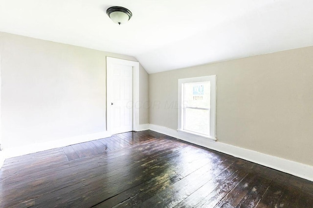 186 S Walnut St, Chillicothe, OH 45601 - empty room with vaulted ceiling and dark wood-style floors