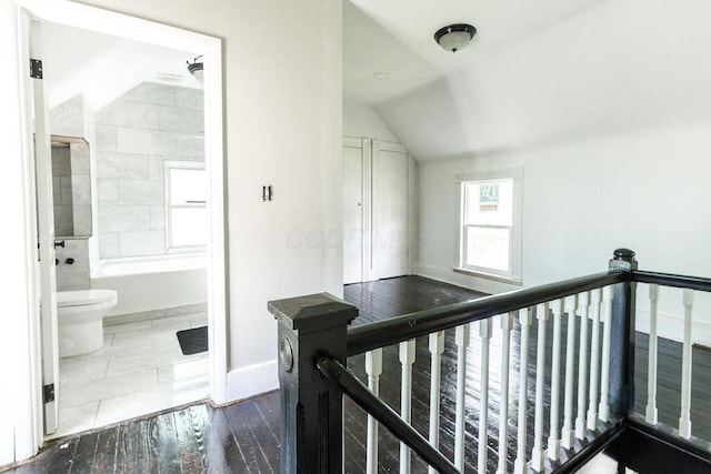 186 S Walnut St, Chillicothe, OH 45601 - hallway featuring vaulted ceiling, an upstairs landing, and wood finished floors