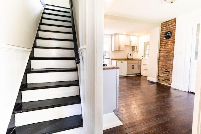 186 S Walnut St, Chillicothe, OH 45601 - stairs with wood-type flooring and brick wall