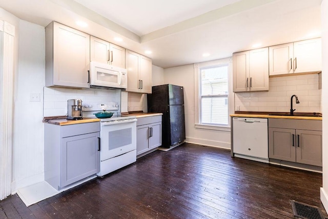 186 S Walnut St, Chillicothe, OH 45601 - kitchen with white appliances, dark wood-style flooring, recessed lighting, and backsplash