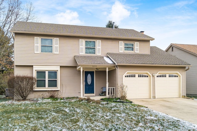 5200 Garmouth Ct, Columbus, OH 43221 - view of front facade featuring driveway, an attached garage, a front lawn, and a shingled roof