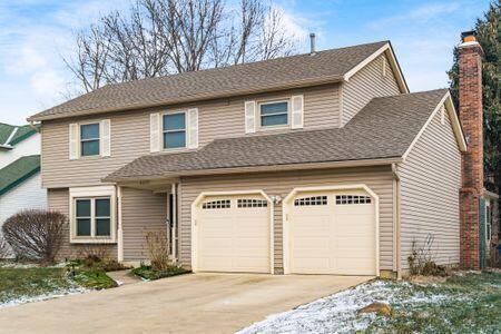 5200 Garmouth Ct, Columbus, OH 43221 - traditional-style home with concrete driveway and a chimney