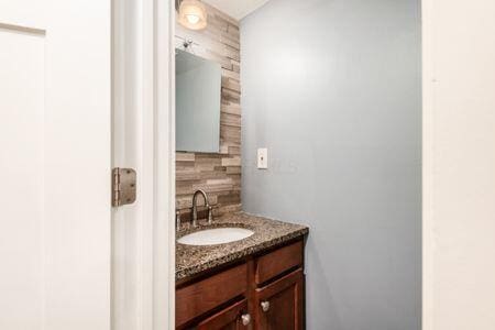 5200 Garmouth Ct, Columbus, OH 43221 - bathroom with backsplash and vanity