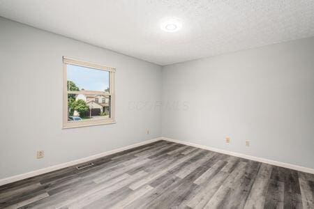5200 Garmouth Ct, Columbus, OH 43221 - spare room featuring wood finished floors and baseboards
