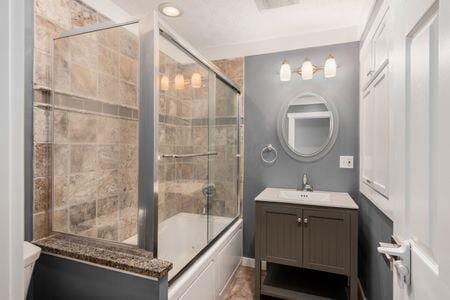 5200 Garmouth Ct, Columbus, OH 43221 - full bath with vanity and shower / bath combination with glass door