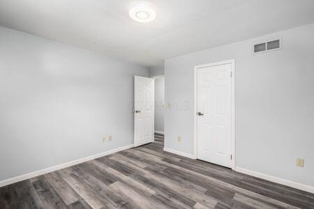 5200 Garmouth Ct, Columbus, OH 43221 - unfurnished bedroom featuring wood finished floors