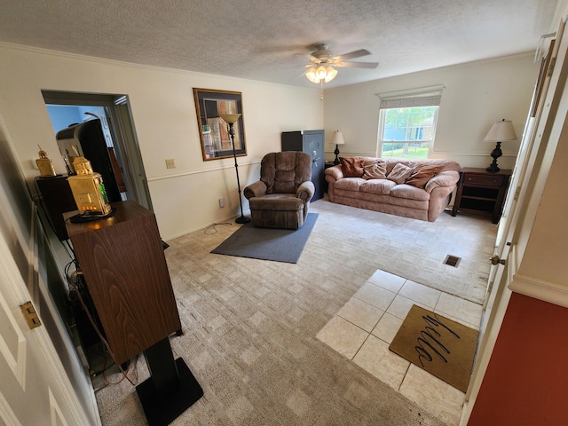 450 Williamsburg Ln Unit A, Lancaster, OH 43130 - living room with light carpet, ceiling fan, a textured ceiling, crown molding, and light tile patterned floors