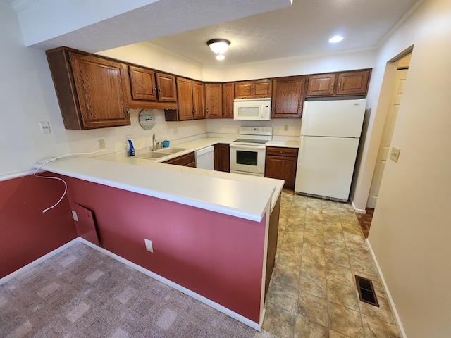 450 Williamsburg Ln Unit A, Lancaster, OH 43130 - kitchen featuring white appliances, a peninsula, light countertops, recessed lighting, and brown cabinetry