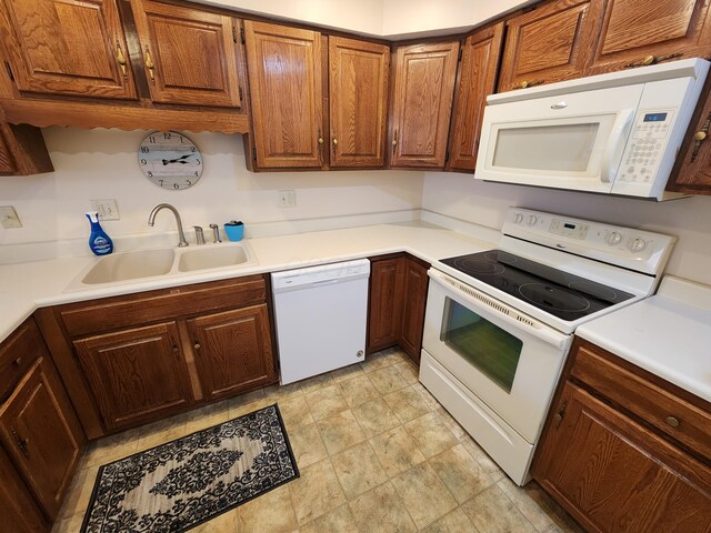 450 Williamsburg Ln Unit A, Lancaster, OH 43130 - kitchen with white appliances, light countertops, and brown cabinets