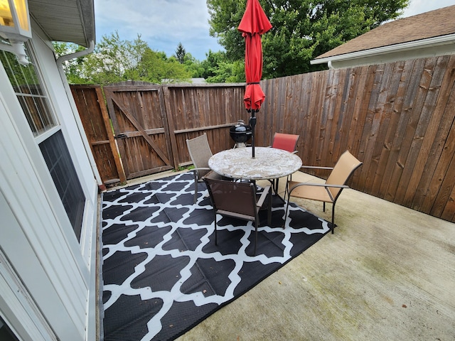450 Williamsburg Ln Unit A, Lancaster, OH 43130 - view of patio / terrace with outdoor dining area and a gate