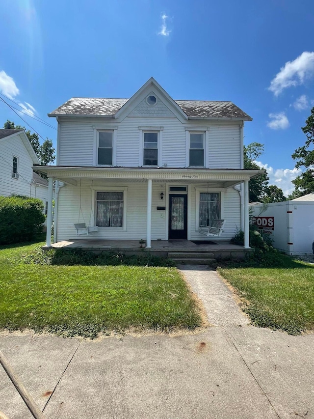 79 Main St E, Ashville, OH 43103 - victorian-style house with covered porch and a front lawn