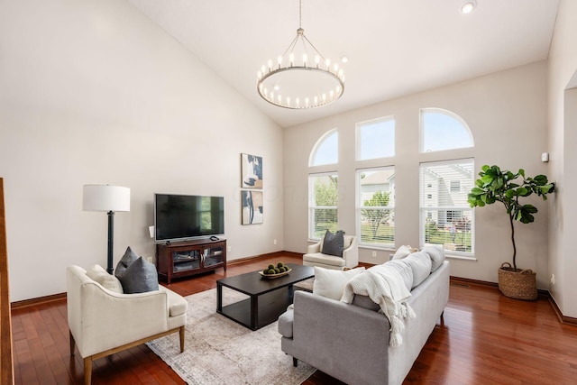 6923 Bishops Crossing Cir, Dublin, OH 43016 - living area featuring high vaulted ceiling, a chandelier, and wood finished floors