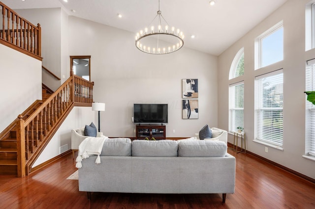 6923 Bishops Crossing Cir, Dublin, OH 43016 - living area with stairway, high vaulted ceiling, a chandelier, wood finished floors, and recessed lighting