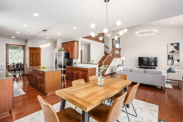 6923 Bishops Crossing Cir, Dublin, OH 43016 - dining space with a chandelier, dark wood-type flooring, recessed lighting, and stairway
