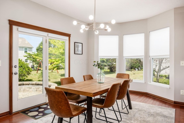 6923 Bishops Crossing Cir, Dublin, OH 43016 - dining space with wood finished floors and a chandelier