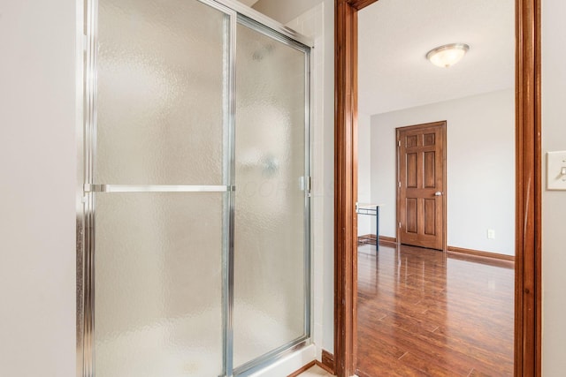6923 Bishops Crossing Cir, Dublin, OH 43016 - bathroom with wood finished floors and a stall shower