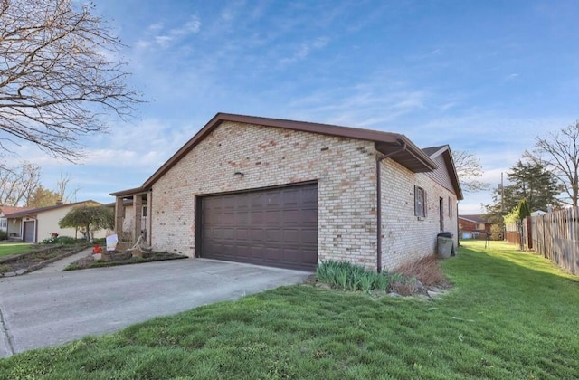12232 Cleo Rd, Orient, OH 43146 - view of property exterior featuring an attached garage, brick siding, and concrete driveway