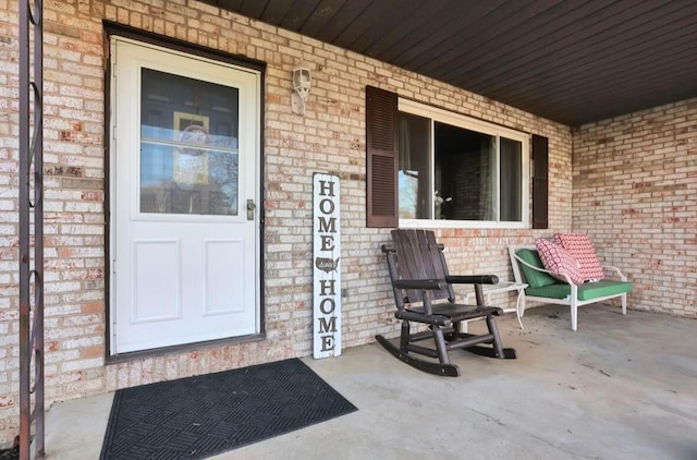 12232 Cleo Rd, Orient, OH 43146 - view of exterior entry with brick siding and a porch