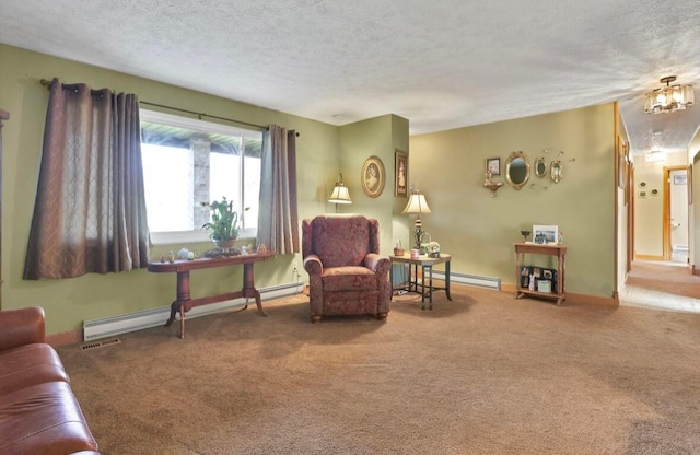 12232 Cleo Rd, Orient, OH 43146 - sitting room featuring carpet floors, a textured ceiling, and a baseboard heating unit