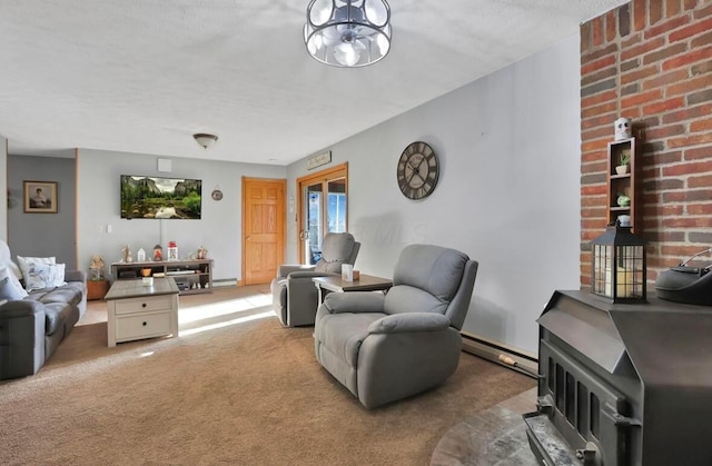 12232 Cleo Rd, Orient, OH 43146 - carpeted living room with a wood stove, a baseboard heating unit, and a textured ceiling