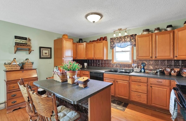 12232 Cleo Rd, Orient, OH 43146 - kitchen featuring black appliances, dark countertops, a breakfast bar, tasteful backsplash, and a textured ceiling