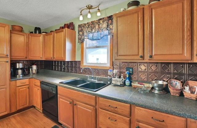 12232 Cleo Rd, Orient, OH 43146 - kitchen featuring dishwasher, a textured ceiling, backsplash, and light wood-style flooring