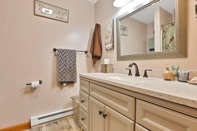 12232 Cleo Rd, Orient, OH 43146 - bathroom with a baseboard heating unit, vanity, and wood finished floors