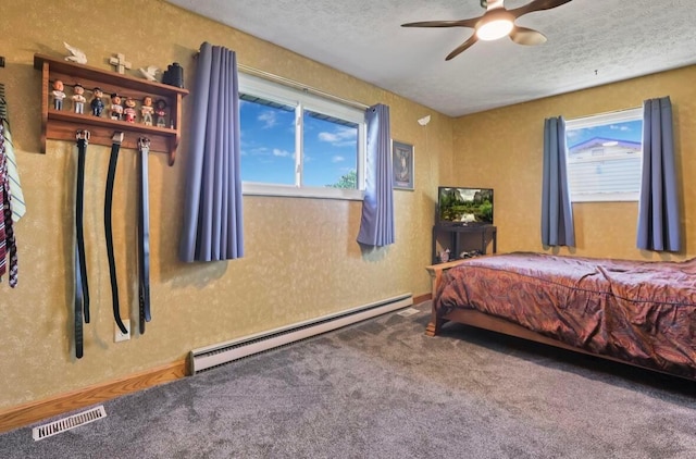 12232 Cleo Rd, Orient, OH 43146 - carpeted bedroom with a baseboard heating unit, a textured ceiling, and a ceiling fan