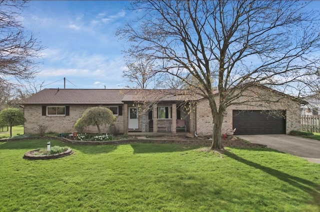 12232 Cleo Rd, Orient, OH 43146 - single story home with concrete driveway, a garage, a front yard, and brick siding