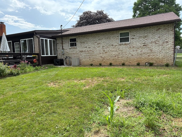 12232 Cleo Rd, Orient, OH 43146 - rear view of house with brick siding, a lawn, crawl space, and a chimney
