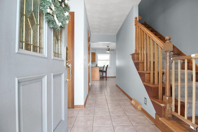 6146 Catawba Dr, Grove City, OH 43123 - entrance foyer featuring light tile patterned floors, stairs, and ceiling fan