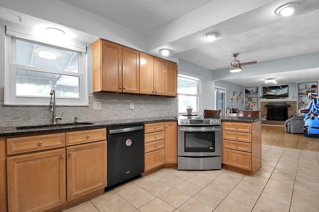 6146 Catawba Dr, Grove City, OH 43123 - kitchen featuring dishwasher, stainless steel electric stove, a peninsula, ceiling fan, and a brick fireplace