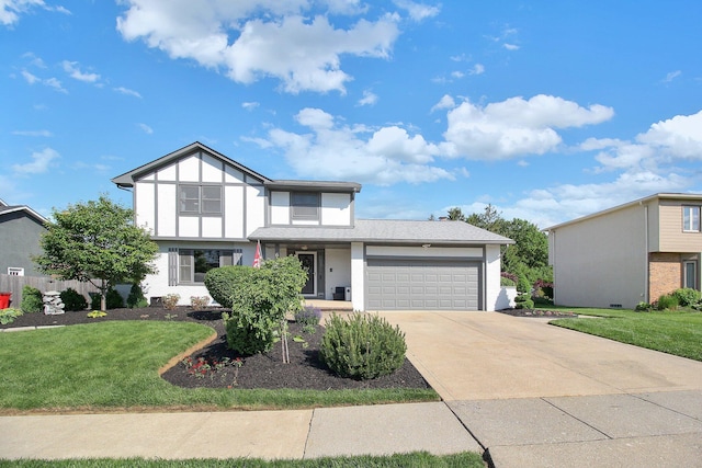 6146 Catawba Dr, Grove City, OH 43123 - english style home featuring a garage, concrete driveway, and a front yard