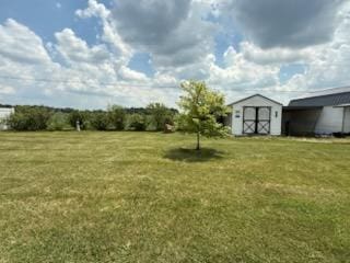 521 Kenton Galion Rd E, Marion, OH 43302 - view of grassy yard with a shed and a carport
