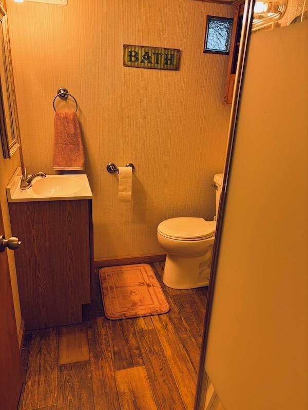 521 Kenton Galion Rd E, Marion, OH 43302 - bathroom with vanity and wood finished floors