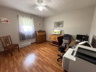 521 Kenton Galion Rd E, Marion, OH 43302 - home office featuring a ceiling fan, wood finished floors, and a baseboard heating unit