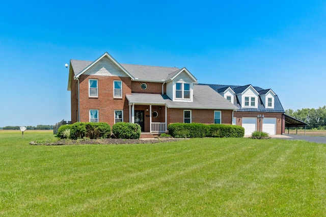 6694 Brooks Miller Rd, Circleville, OH 43113 - view of front of home featuring driveway, a front yard, and brick siding